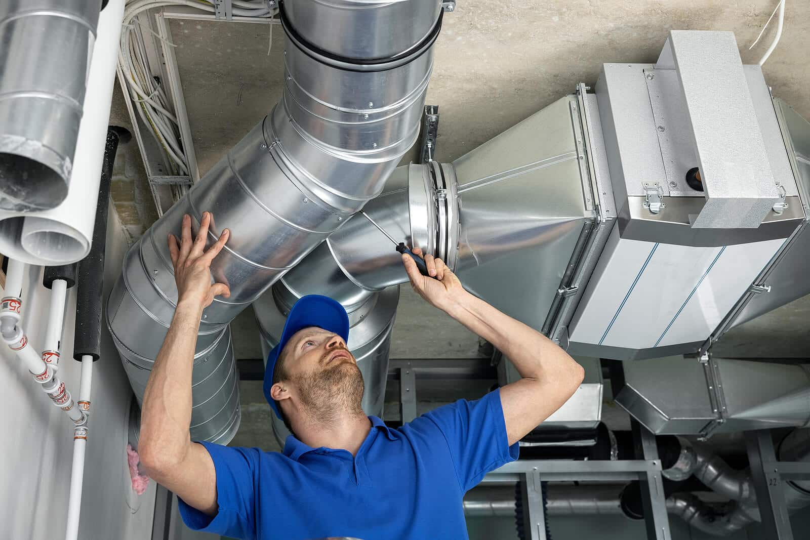 HVAC technician inspecting and repairing air ducts in Diamond Bar