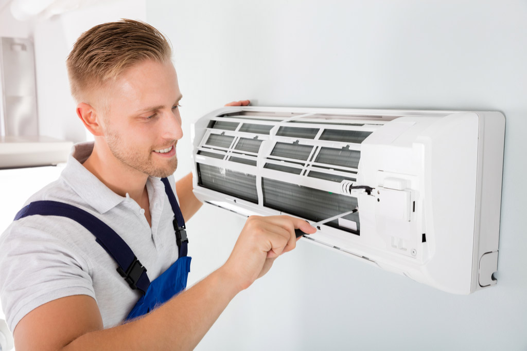 HVAC technician maintaining a ductless air conditioner in Diamond Bar