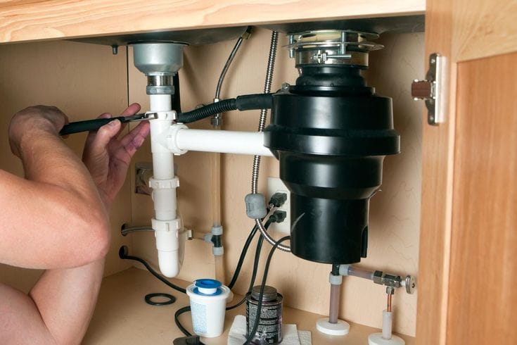 Plumber repairing a garbage disposal in Diamond Bar