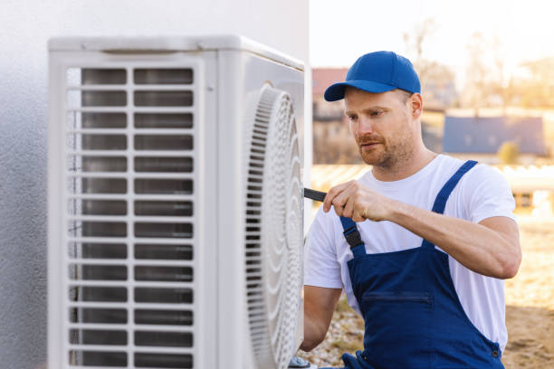HVAC technician servicing an outdoor air conditioner in Diamond Bar