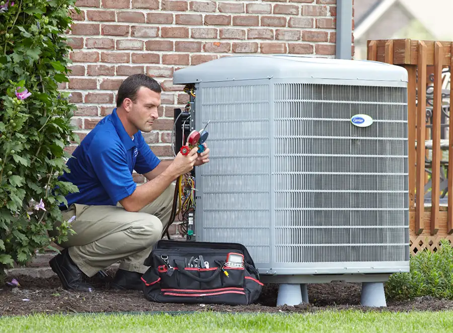 HVAC technician inspecting an outdoor AC unit in Diamond Bar