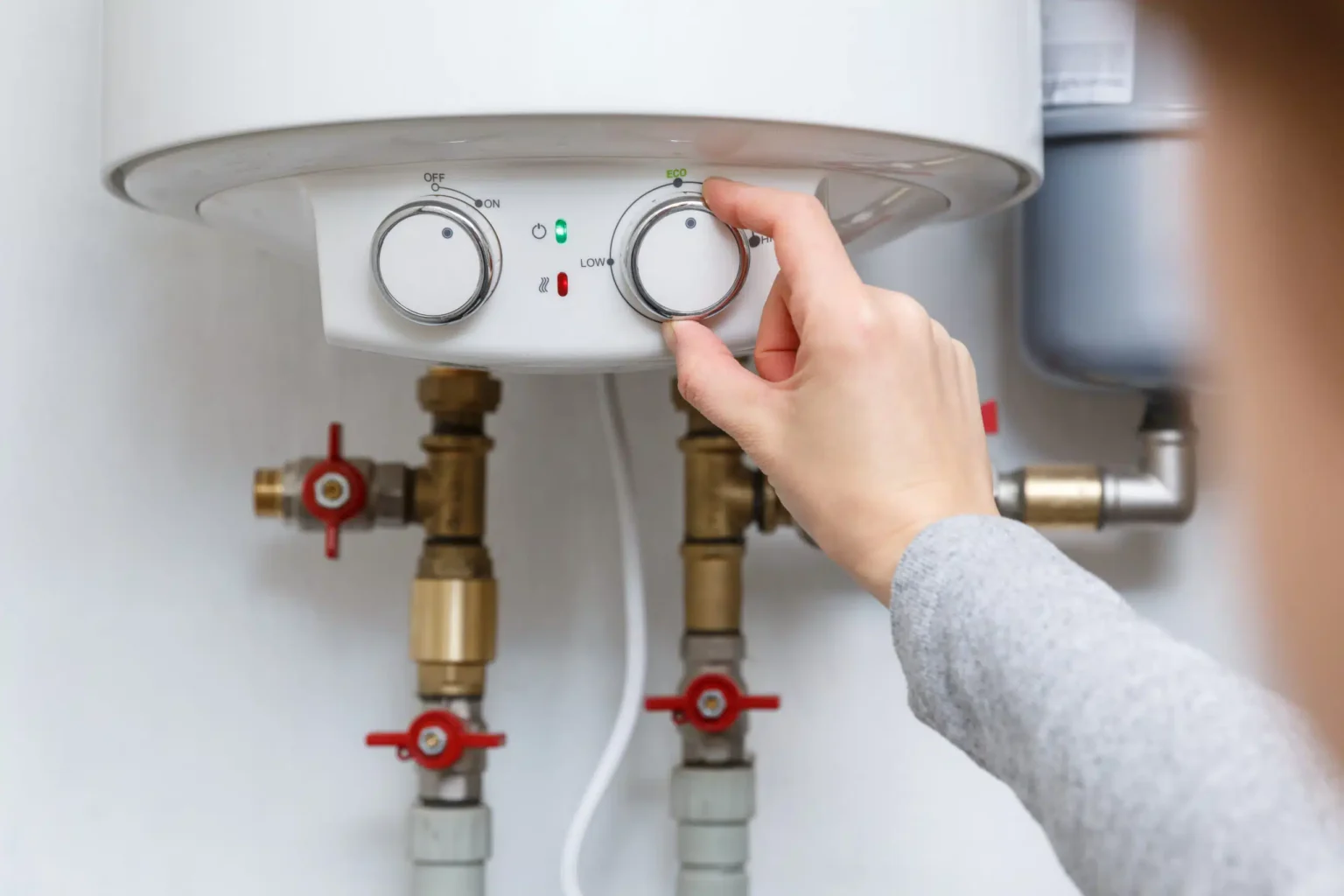 Technician adjusting a water heater in Diamond Bar